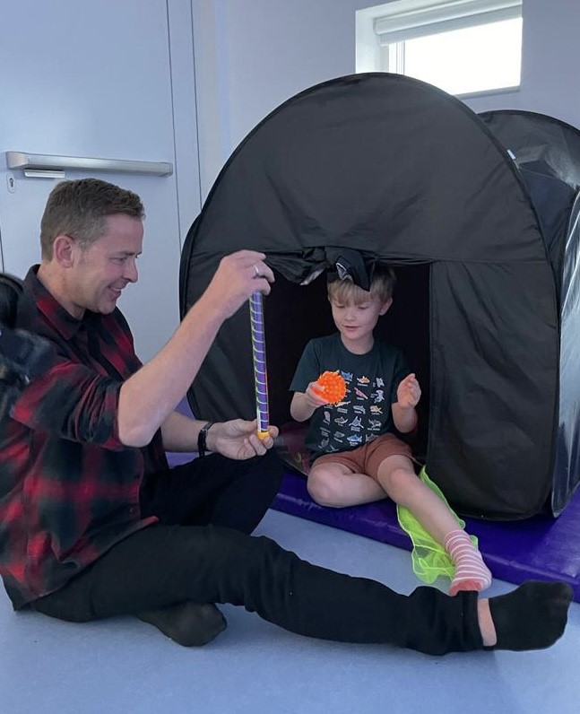 Radio 2 DJ Scott Mills and Finley enjoy play at a Sparkle afterschool club